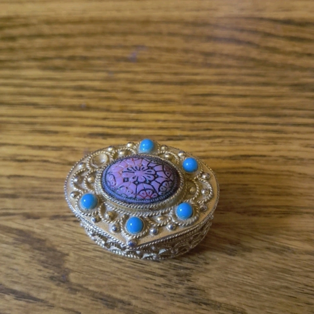 Elegant Gold and Blue Brooch with Pink Centerpiece